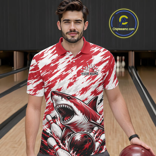 Man wearing a red and white polo shirt with a shark design on a bowling alley.