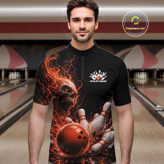 Front view of a male model in a bowling alley wearing a black quarter zip bowling shirt with an orange flaming skull, lightning, bowling pins, and a custom name.