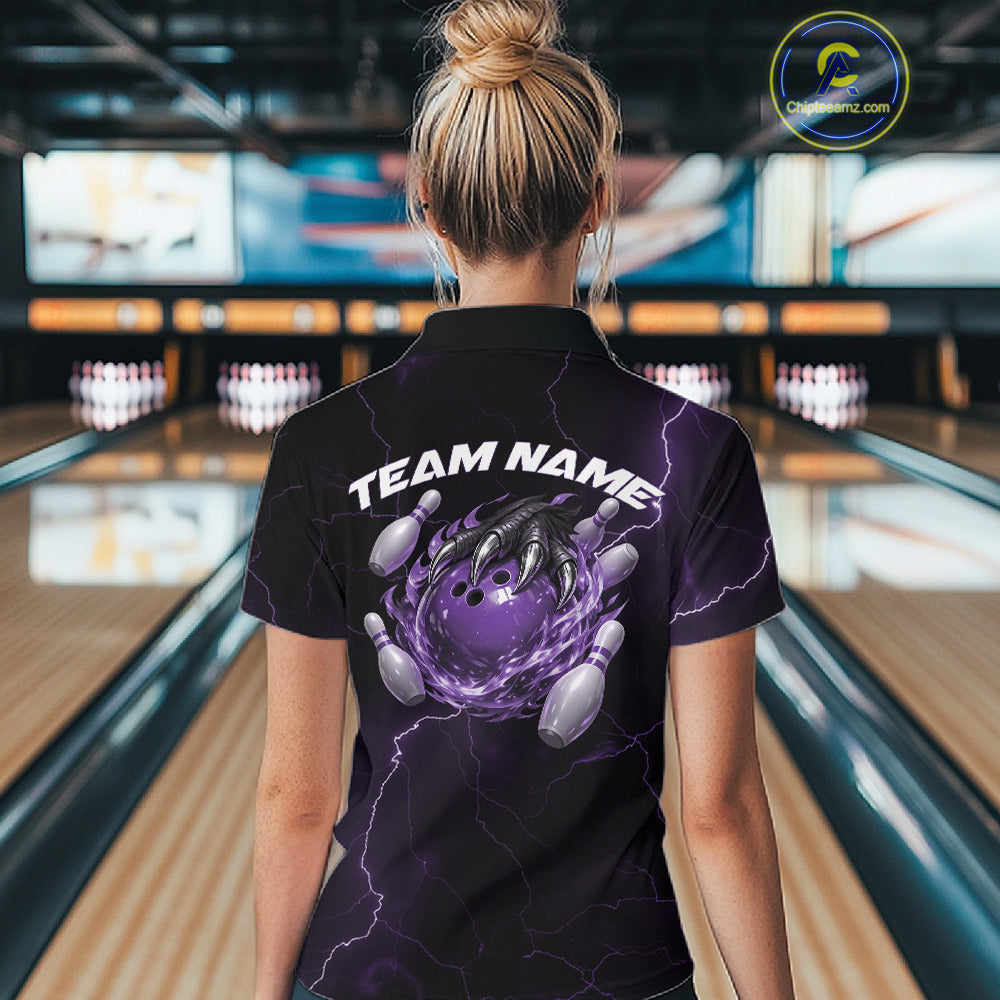 Back view of a black and purple womens quarter-zip displaying dragon claw bowling artwork with flames.