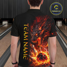 Load image into Gallery viewer, Person wearing a black shirt with a fiery dragon design and 'TEAM NAME' text in a bowling alley.