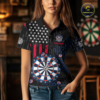 Female model wearing a custom black darts polo shirt featuring an American flag star pattern, a large dartboard graphic, and customizable 'YOUR NAME' text on the chest