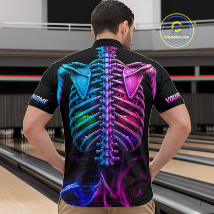 A man viewed from behind wearing a black short-sleeve polo shirt with a large colorful neon-style rib cage graphic on the back, standing in a bowling alley. The shirt has placeholder text on the sleeves