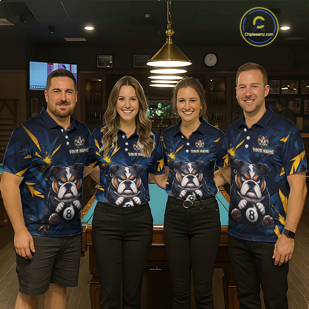 A team of four pool players stand in front of a blue felt pool table in a billiards room. All four are wearing the front view of the custom blue and yellow billiards polo shirt with a bulldog and 8-ball motif, and 'YOUR NAME' text placeholder. 