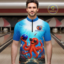 Load image into Gallery viewer, Man wearing a blue and white bowling shirt with an octopus design in a bowling alley.