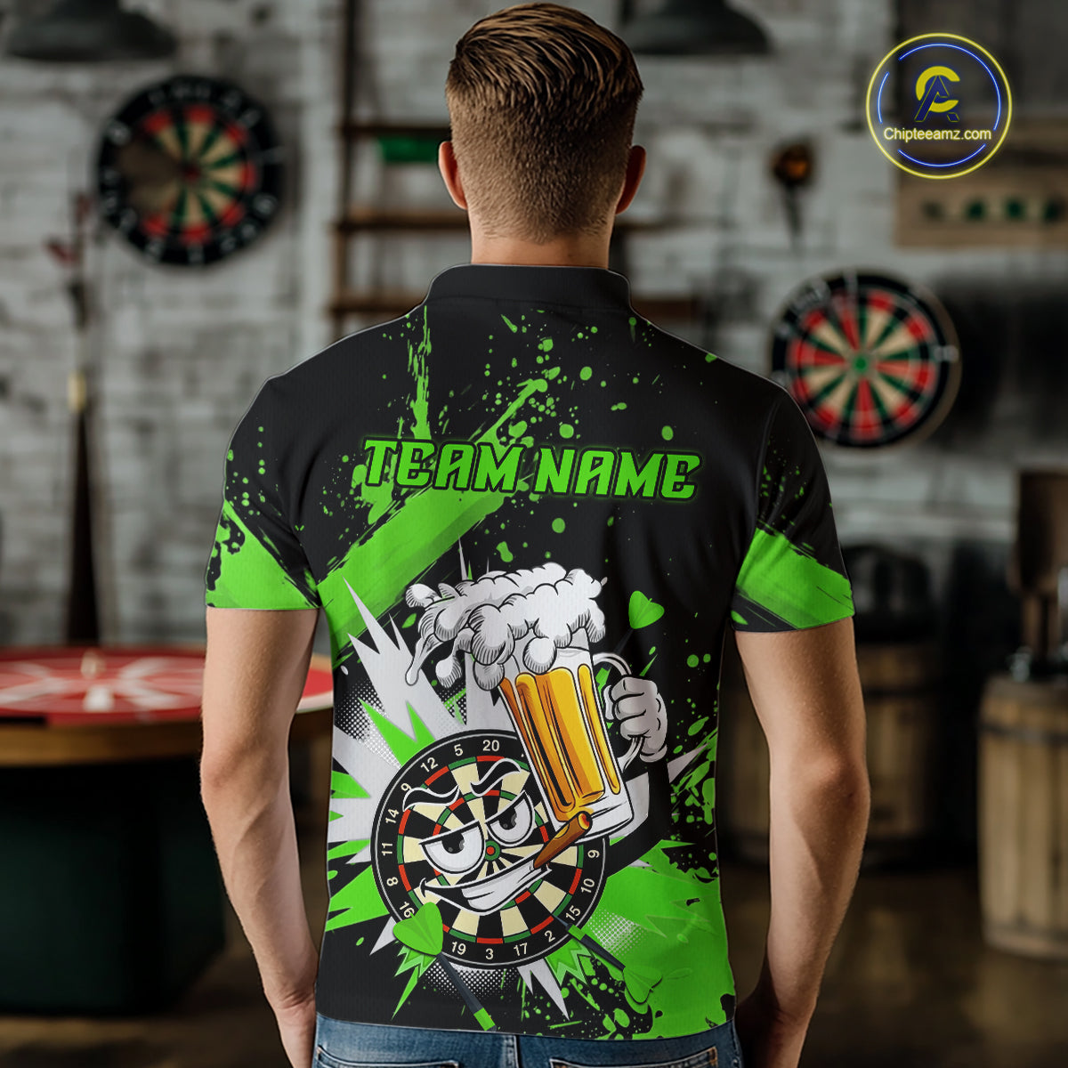 A man viewed from behind wearing a black short-sleeve polo shirt with a bright green and white graphic design on the back. The design features the text 'TEAM.