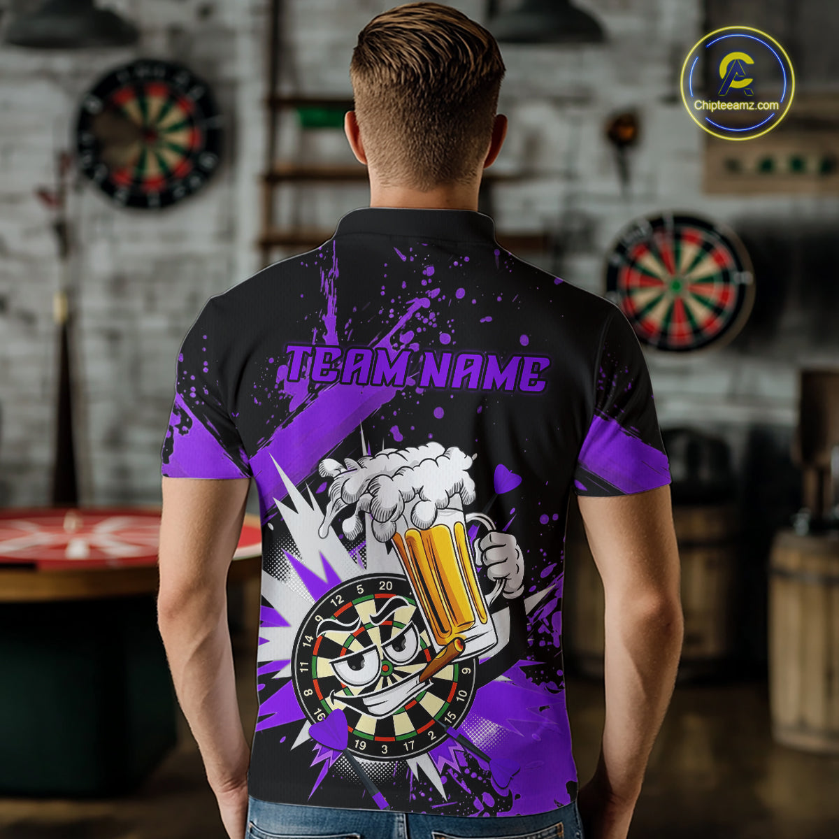 A man viewed from behind wearing a black short-sleeve polo shirt with a purple and white graphic design on the back. The design features the text 'TEAM.