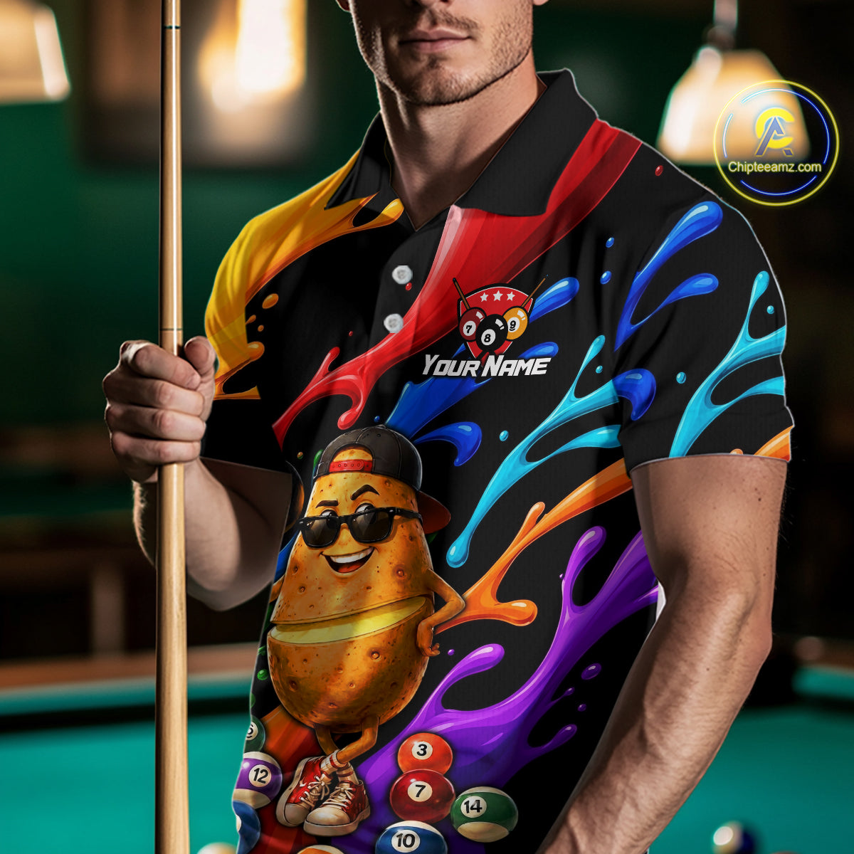 Person wearing a colorful polo shirt with a pool-themed design, holding a pool cue.