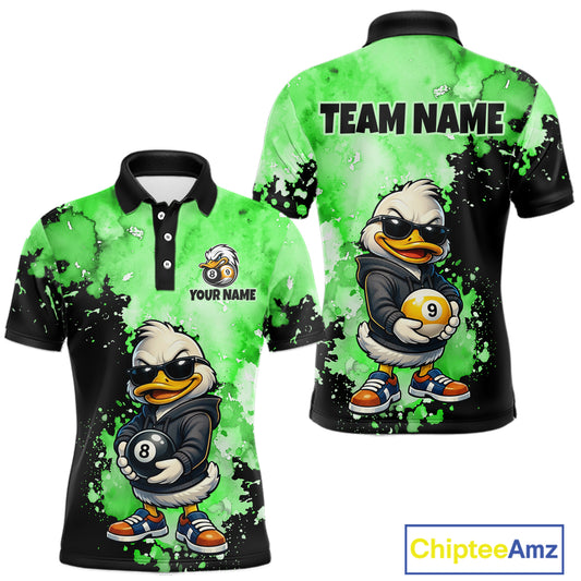 Custom short-sleeve polo shirt shown from the front and back, featuring a cartoon duck character in a black jacket holding pool balls, with a bright green and black splatter background. The front has a small customizable logo area and the back has 'TEAM NAME' printed at the top.
