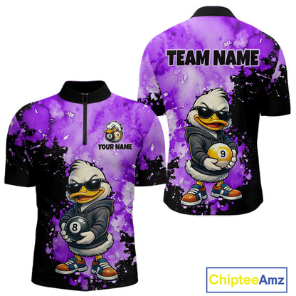 Front and back views of a short-sleeve polo shirt with a purple and black watercolor splatter design, featuring a cartoon duck character wearing sunglasses and holding pool balls. The front has a half-zip collar, a small cartoon logo, and the text 'YOUR NAME', while the back has 'TEAM NAME' printed at the top.