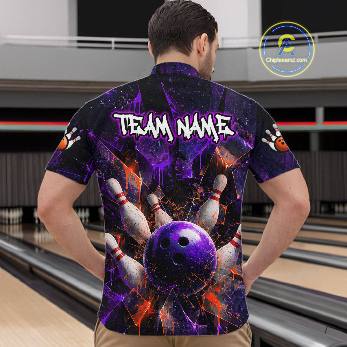A man viewed from behind wearing a short-sleeve bowling-themed shirt with a purple and black cosmic design, bowling pins, a bowling ball, and the text 'TEAM NAME' on the back. Bowling lanes are visible in the background.