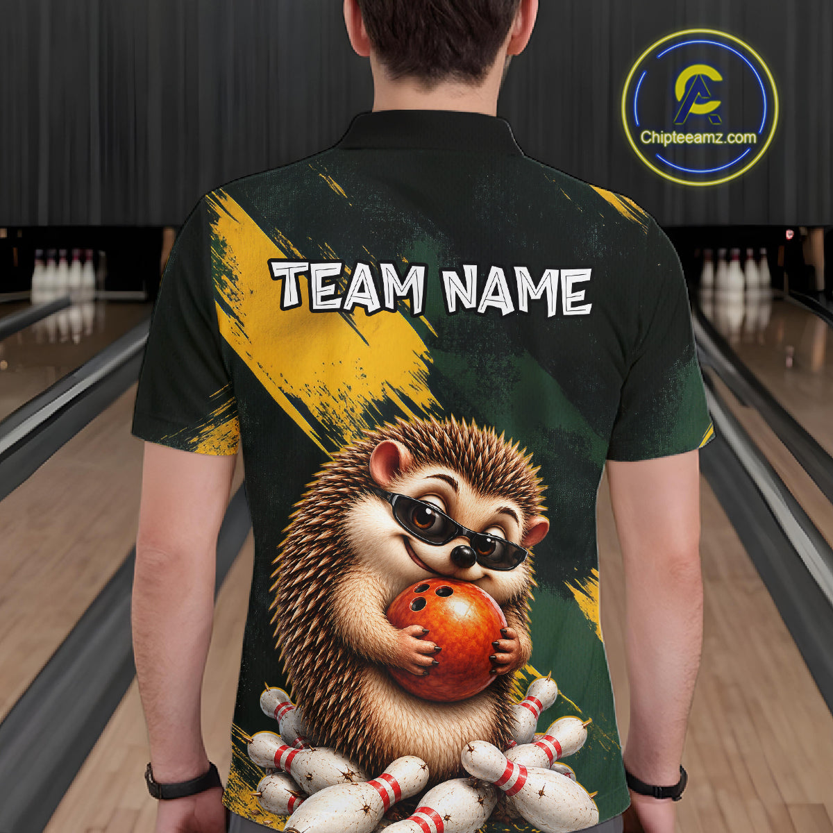 A person shown from the back wearing a short-sleeve bowling-themed polo shirt with a large hedgehog graphic holding a bowling ball, white pins, and the text 'TEAM NAME' across the upper back. Bowling lanes are visible in the background