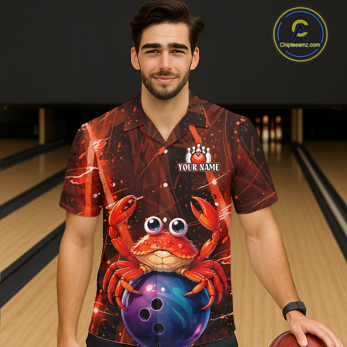 Man wearing a colorful shirt with a crab and bowling ball design on a bowling alley.