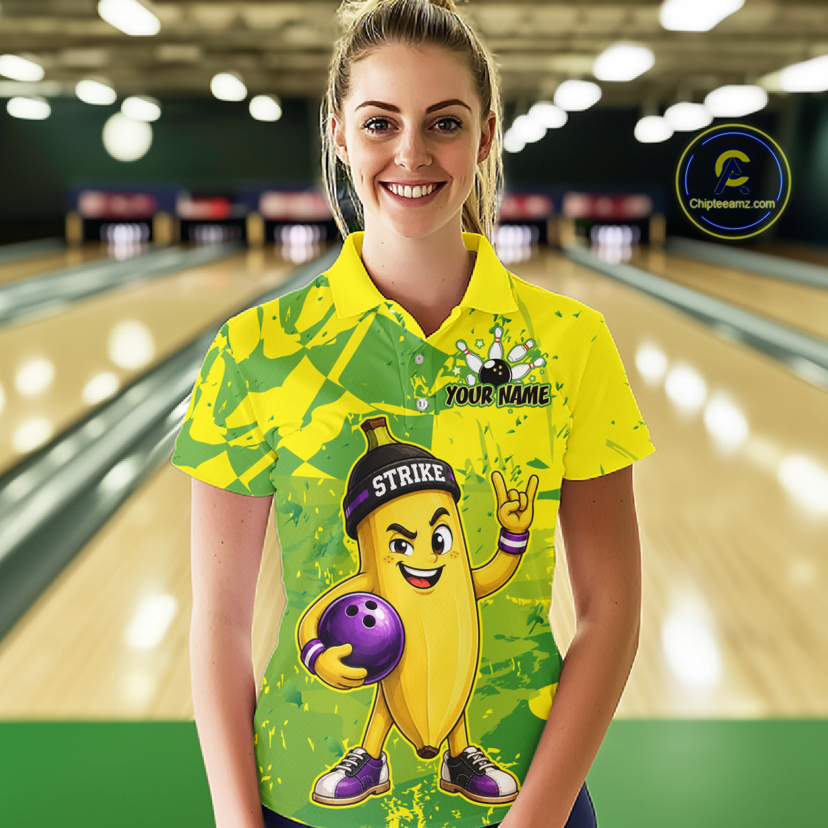 A woman wearing custom yellow banana bowling polo shirt front view featuring a funny cartoon fruit and bowling ball, displaying Your Name, at the bowling alley