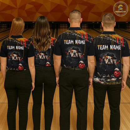 Four people standing with their backs to the camera in a bowling alley, wearing matching black short-sleeve shirts with a custom bulldog graphic and 'TEAM NAME' printed across the back.