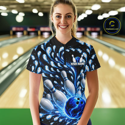 Person wearing a bowling-themed shirt with a blue and black design in a bowling alley.
