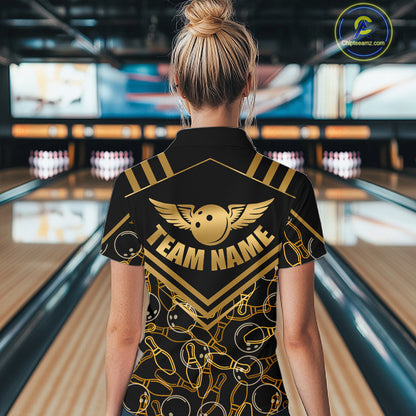 Female model wearing a custom black gold bowling quarter-zip shirt back view displaying the personalized team name above a golden winged bowling ball graphic at the bowling alley