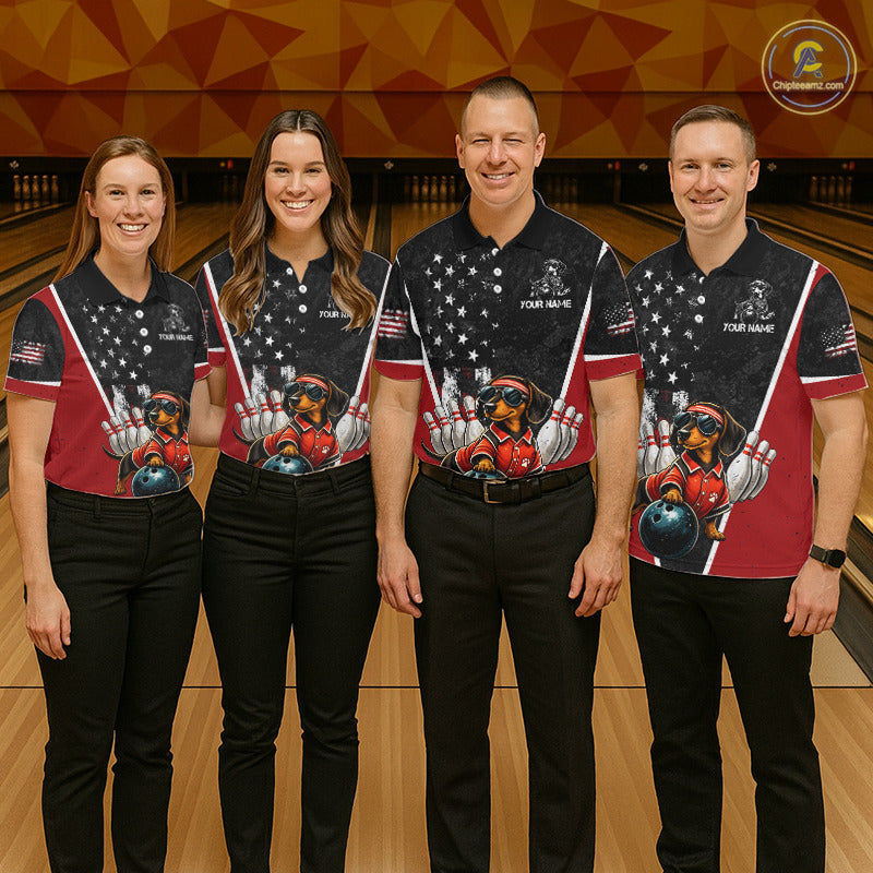 Four people standing together in a bowling alley wearing matching bowling shirts with a patriotic American flag design and a cartoon dog graphic, paired with black pants.