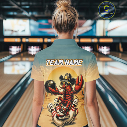 Person wearing a shirt with a crawfish bowling design in a bowling alley.