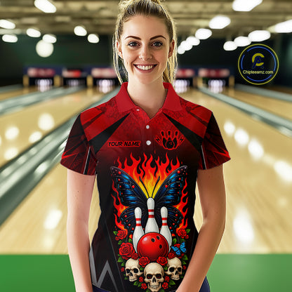 Woman wearing a red and black bowling polo shirt featuring flaming bowling pins, a red bowling ball, a blue butterfly, roses, skulls, and custom player name text.