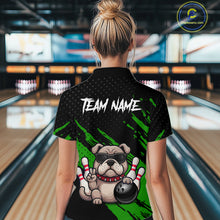 Load image into Gallery viewer, Women’s green Bulldog bowling polo shirt, back view on female model in bowling lane 