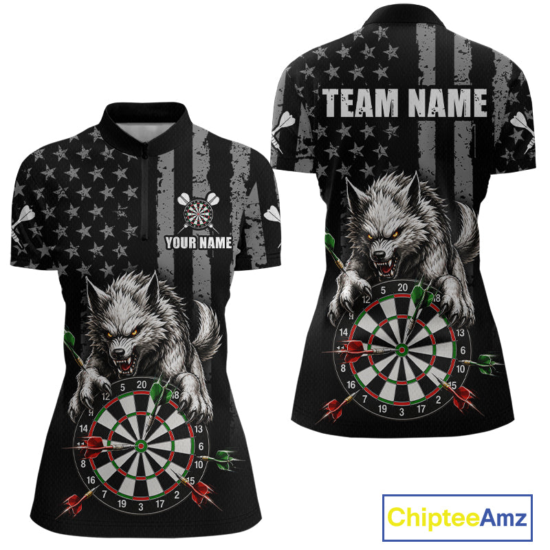 Custom women's short-sleeve polo shirt shown from the front and back, featuring a black and gray distressed American flag pattern, a large gray wolf graphic over a dartboard, and customizable text areas reading 'TEAM NAME' and 'YOUR NAME'.