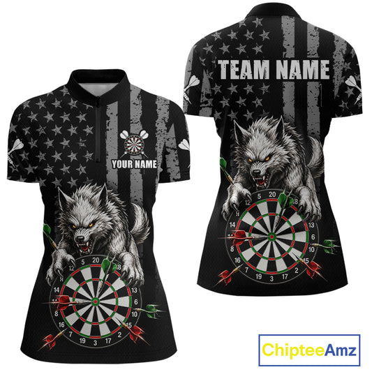 Custom women's short-sleeve polo shirt shown from the front and back, featuring a black and gray distressed American flag pattern, a large gray wolf graphic over a dartboard, and customizable text areas reading 'TEAM NAME' and 'YOUR NAME'.
