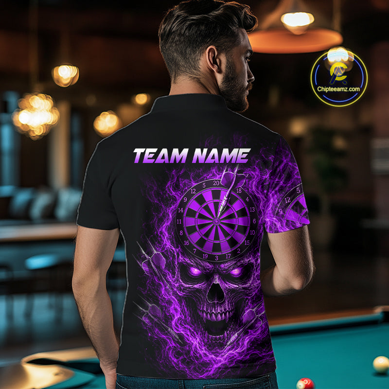 A man viewed from behind wearing a black short-sleeve polo shirt with a large purple and black skull graphic, a dartboard motif, and the text 'TEAM NAME' across the upper back. The shirt is shown in a dimly lit pool hall environment, with a circular 'ChipteeAmz'.