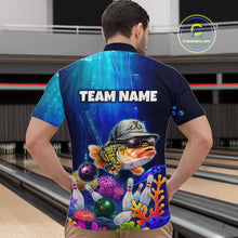 Load image into Gallery viewer, Man wearing an underwater-themed bowling quarter zip featuring a fish mascot wearing sunglasses and a cap, colorful coral reefs, bowling pins, bowling balls, and custom team name text.