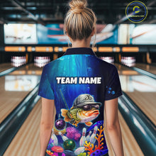 Load image into Gallery viewer, Woman wearing an underwater-themed bowling quarter zip featuring a fish mascot wearing sunglasses and a cap, colorful coral reefs, bowling pins, bowling balls, and custom team text.