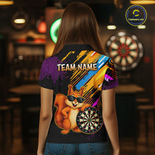 Load image into Gallery viewer, Person wearing a colorful shirt with a cartoon squirrel holding a dartboard in a bar setting.