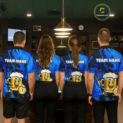 Four people wearing a bright blue billiards polo with black splatter graphics, custom “TEAM NAME” text, and a smiling beer mug mascot holding a pool cue.
