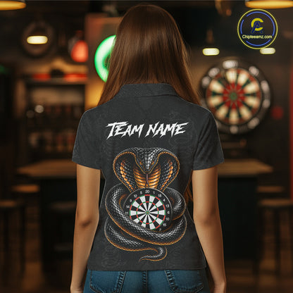 Women wearing darts polo shirt featuring a cobra wrapped around a dartboard with cobra snake artwork on a black background.