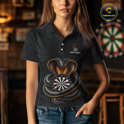 Women wearing darts polo shirt featuring a cobra wrapped around a dartboard with cobra snake artwork on a black background.