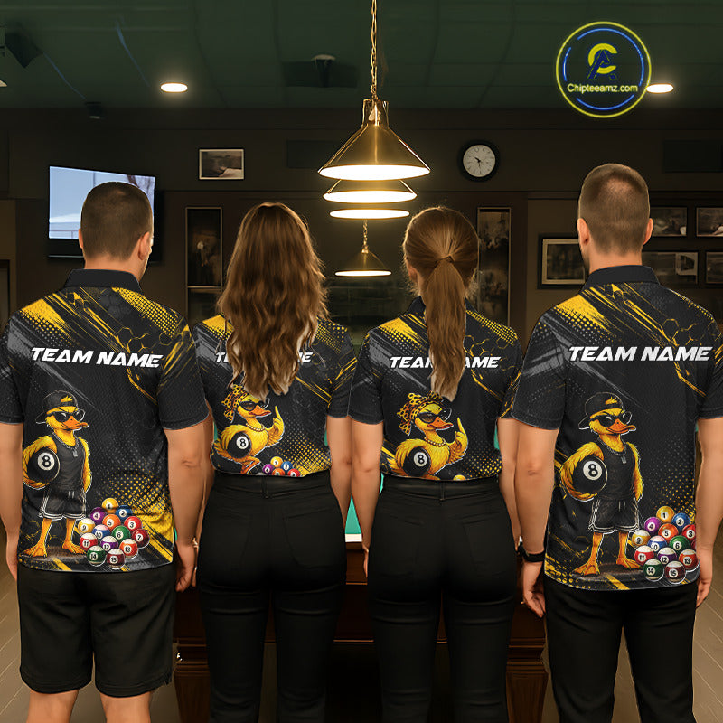 Four people wearing billiards polo shirt featuring a duck holding an eight ball with pool balls arranged across a black yellow background.