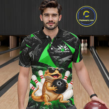 Load image into Gallery viewer, Men’s green bearded dragon bowling polo shirt, front view on male model in bowling lane 