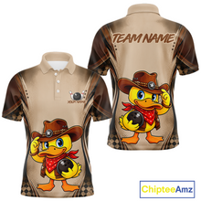 Load image into Gallery viewer, Polo shirt with cartoon duck in cowboy hat design on a beige background, featuring 'Chiptee Amz' branding.