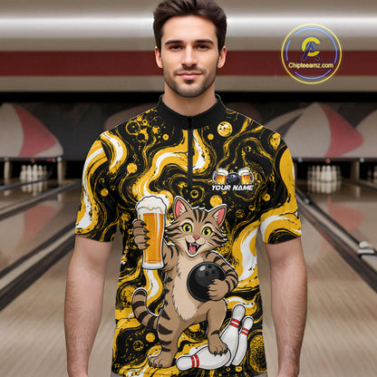 A man wearing a short-sleeve bowling-themed graphic shirt with a cartoon cat holding a beer glass and bowling ball, set against a blurred bowling alley background. 