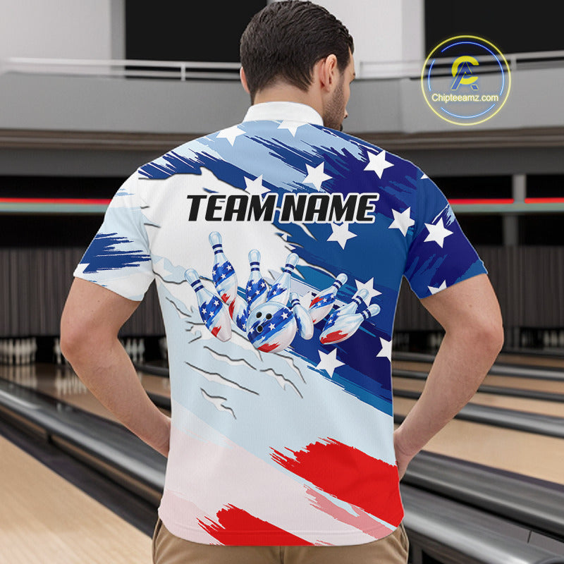 A man viewed from behind wearing a short-sleeve bowling shirt with a patriotic red, white, and blue design featuring bowling pins and the text 'TEAM NAME'. The background shows bowling lanes.