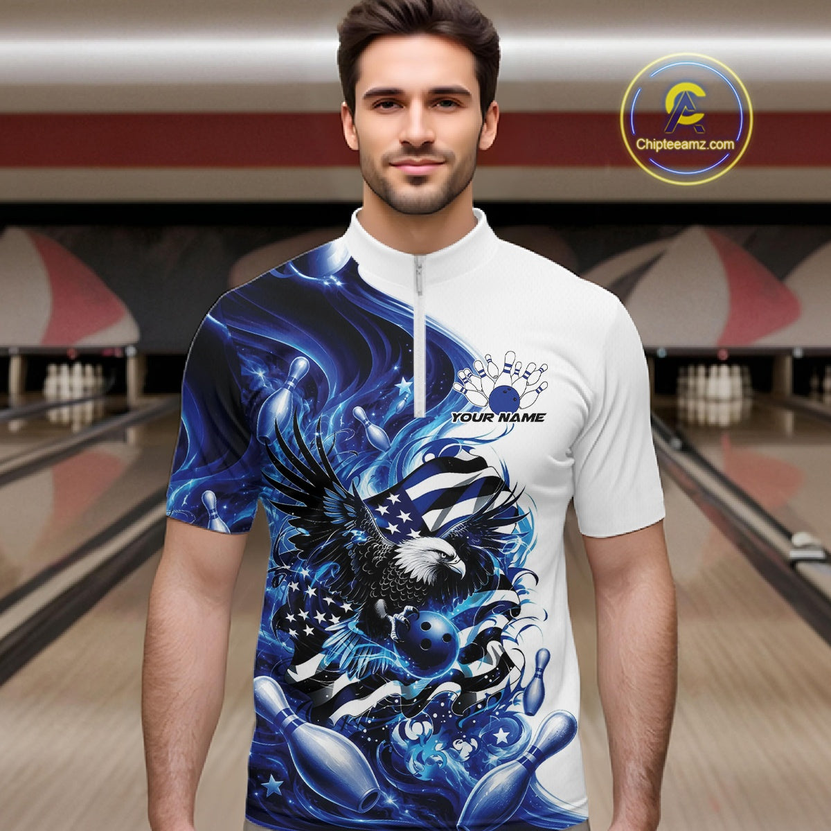 Front view male model in a bowling lane wearing a white and blue quarter zip shirt with eagle artwork, bowling elements, and flowing flag inspired graphics.