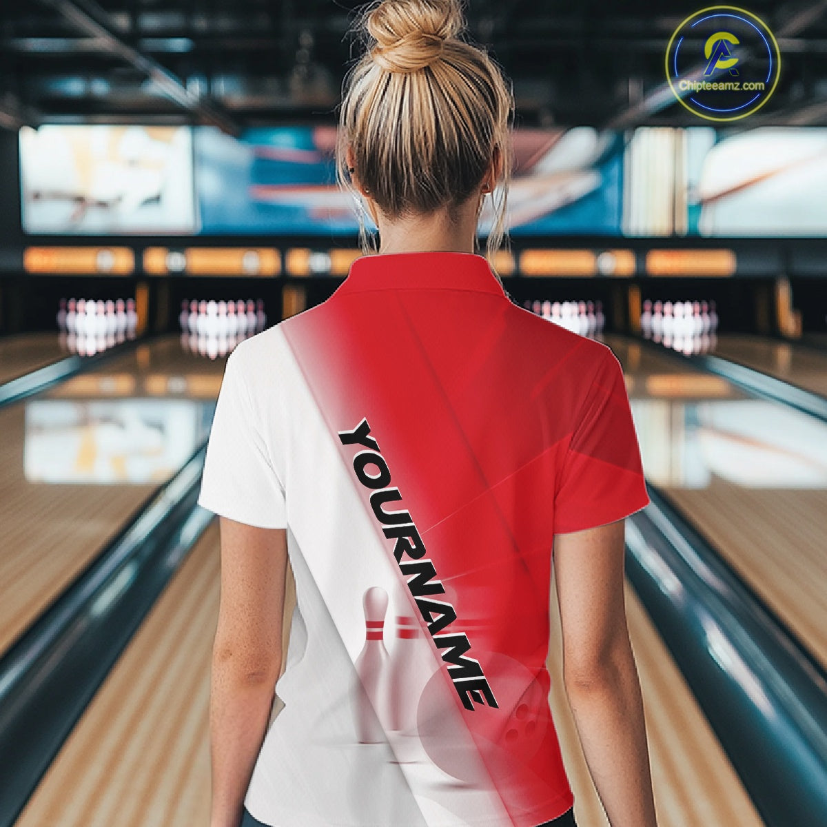 Back view female model in a bowling lane wearing a quarter zip shirt with bowling ball and pins across a red and white diagonal layout.