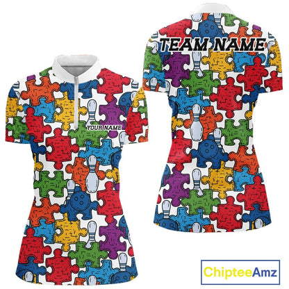 Front and back views of a short-sleeve polo shirt with a colorful bowling-themed jigsaw puzzle pattern on a white background. The shirt features a white collar, a short white zipper at the neck, and customizable text placeholders 'YOURNAME' on the front and 'TEAM_NAME' on the back.