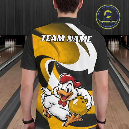 A man viewed from behind wearing a black short-sleeve polo shirt with a large yellow, white, and black graphic design on the back, featuring a cartoon chicken holding a bowling ball and the text 'TEAM NAME'. 