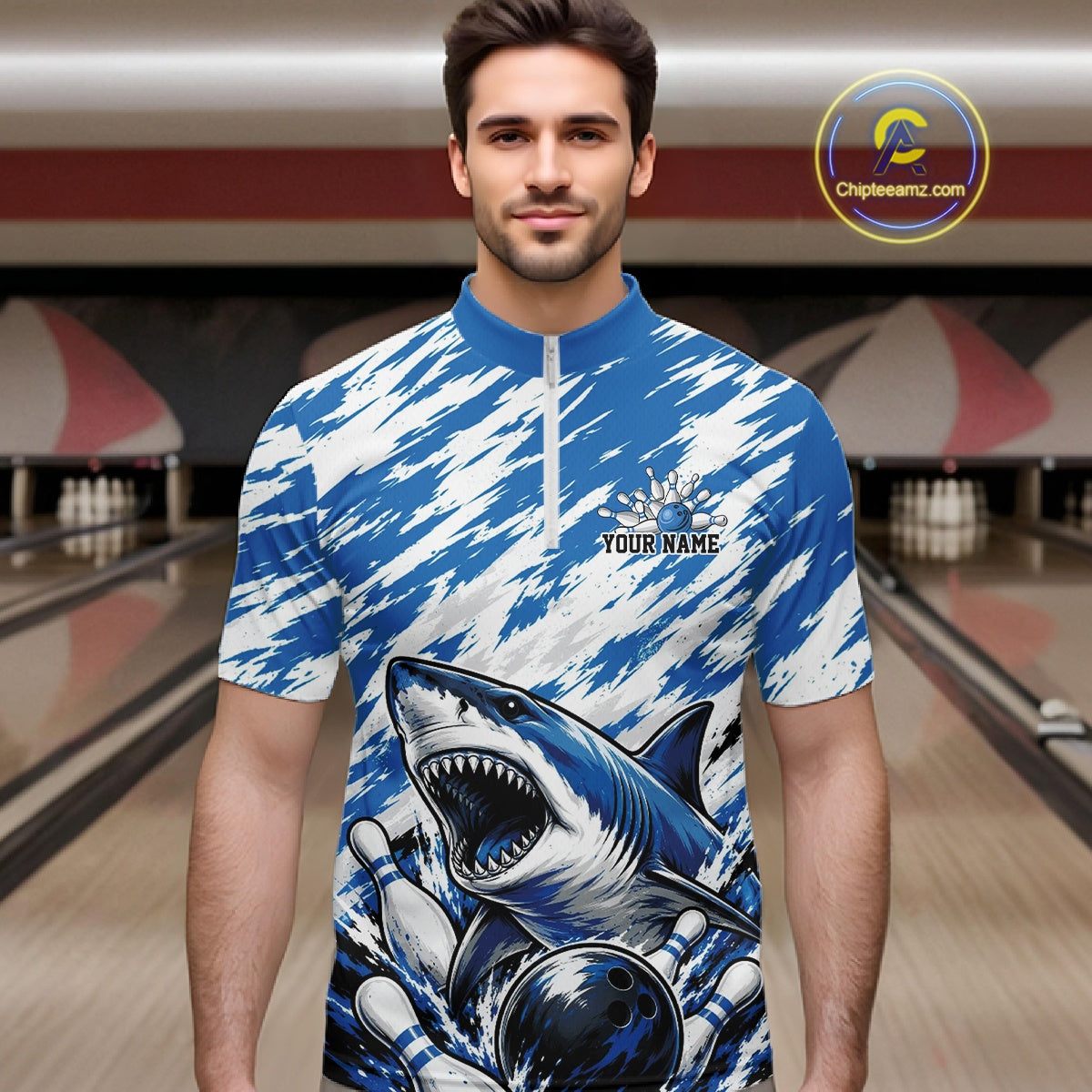 Man wearing a blue and white sports jersey with a shark design in a bowling alley.