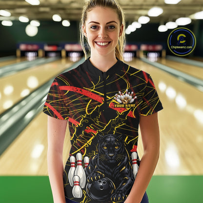 A woman wearing a custom bowling-themed short-sleeve polo shirt with a black background, yellow and red abstract lines, a black panther graphic, bowling pins, and a bowling ball. The shirt has a placeholder name on the chest.
