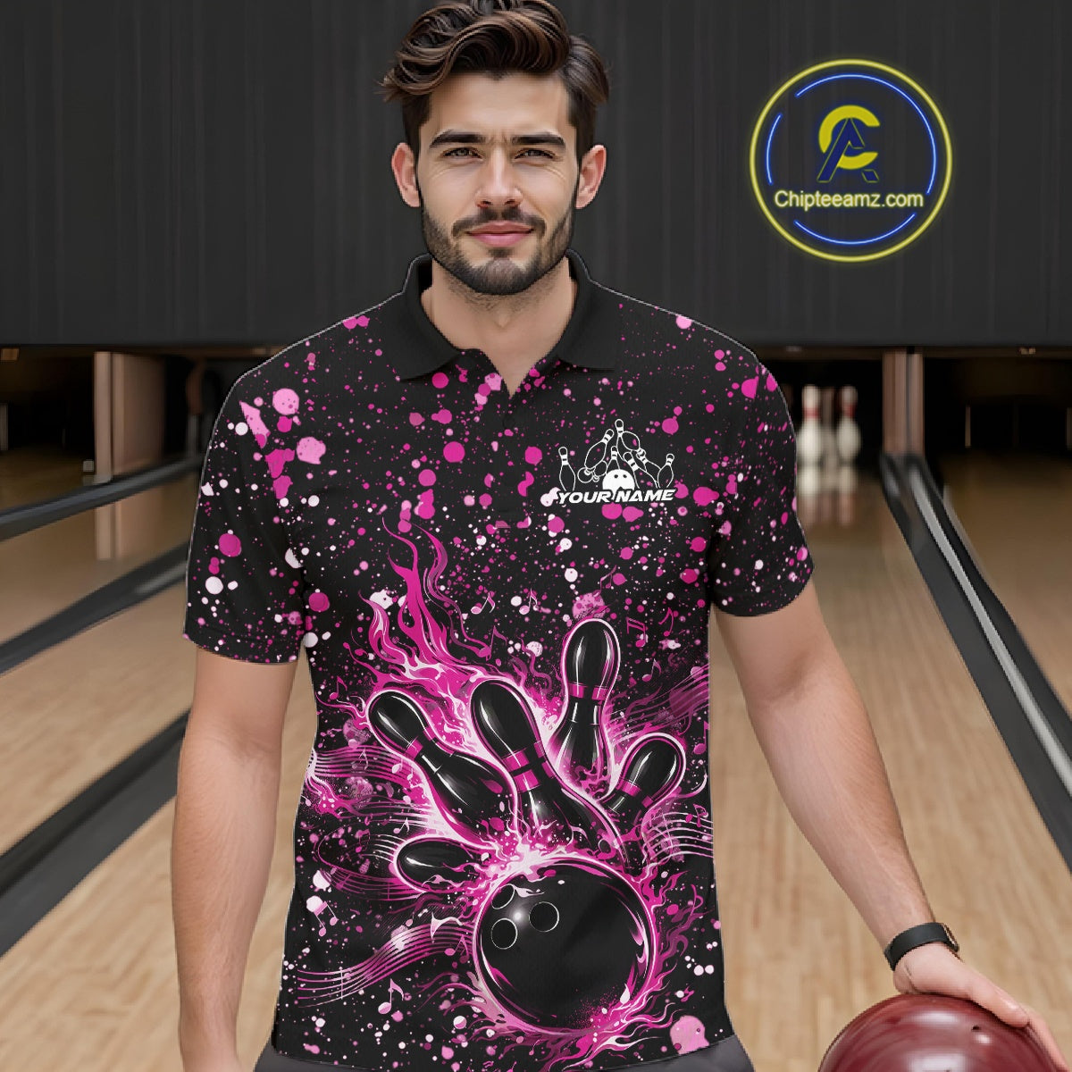 Male model wearing a black bowling polo shirt at the bowling lane with pink music-inspired bowling graphics.