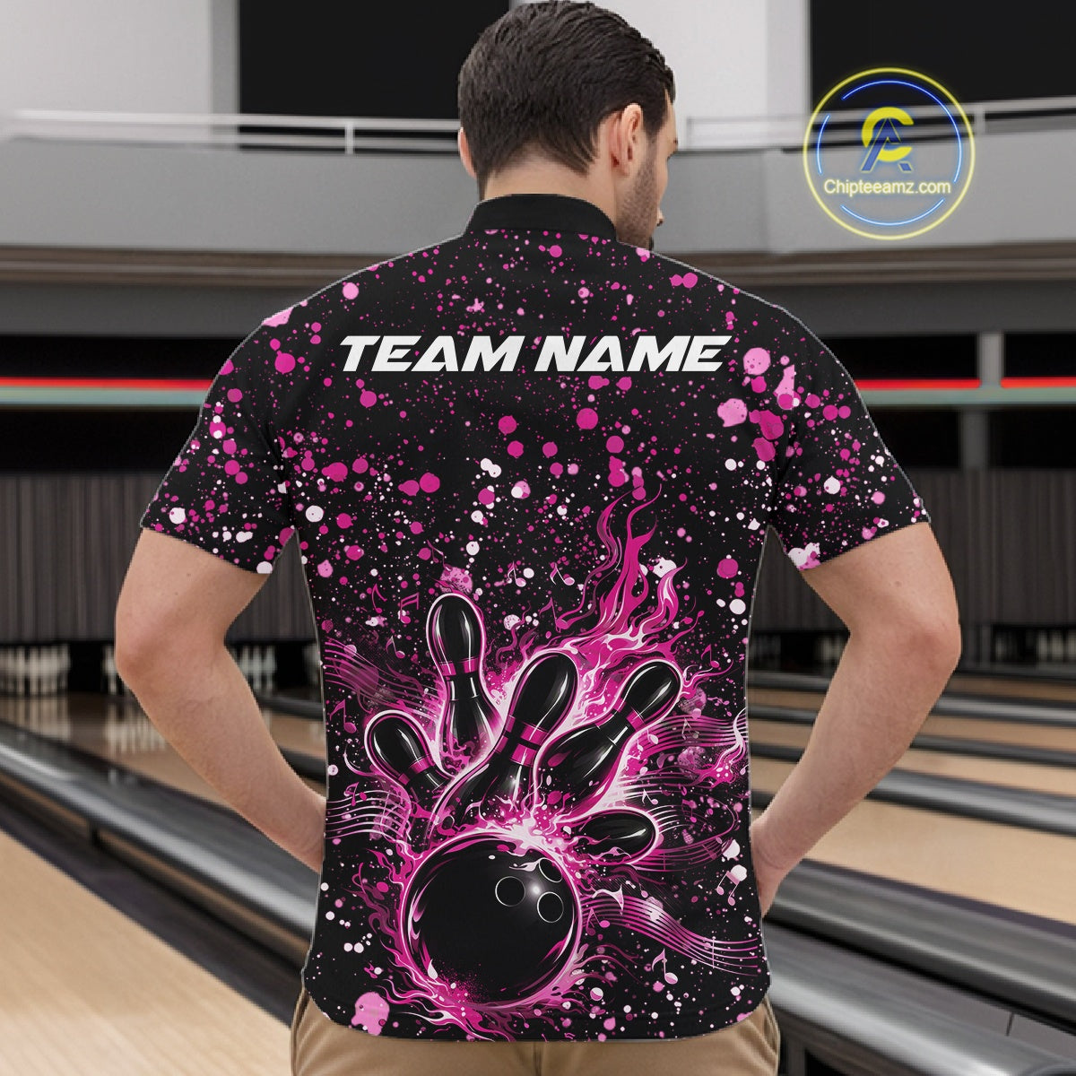 Front view of a male model in a black bowling quarter-zip shirt displaying pink music-themed splatter bowling artwork.