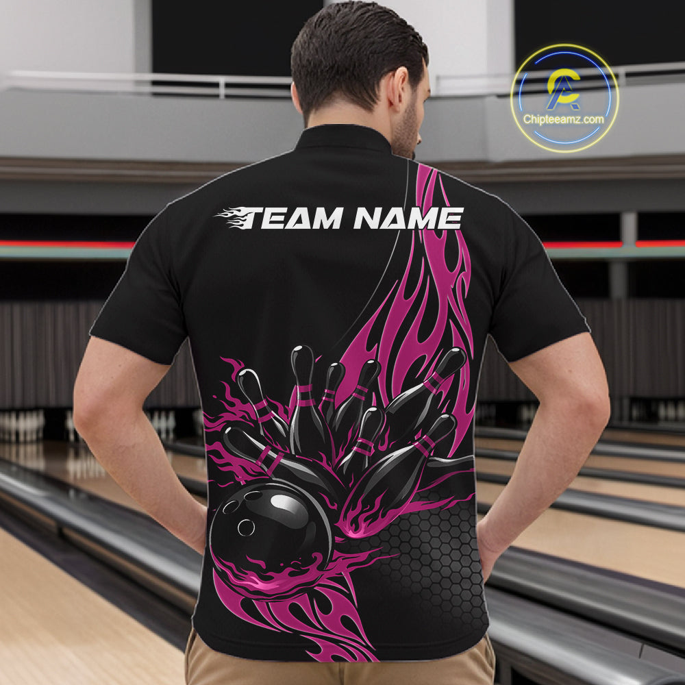 Front view male model at bowling venue wearing black quarter zip with pink flame bowling ball hitting pins in dynamic sports action scene.