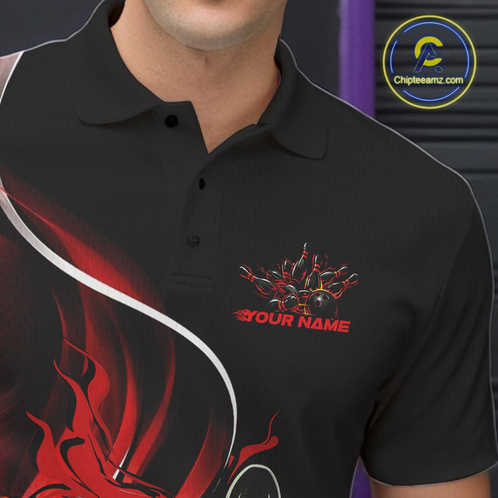 Close-up view of the left chest area of a black and red bowling polo shirt showing a flame bowling ball and pins design detail.
