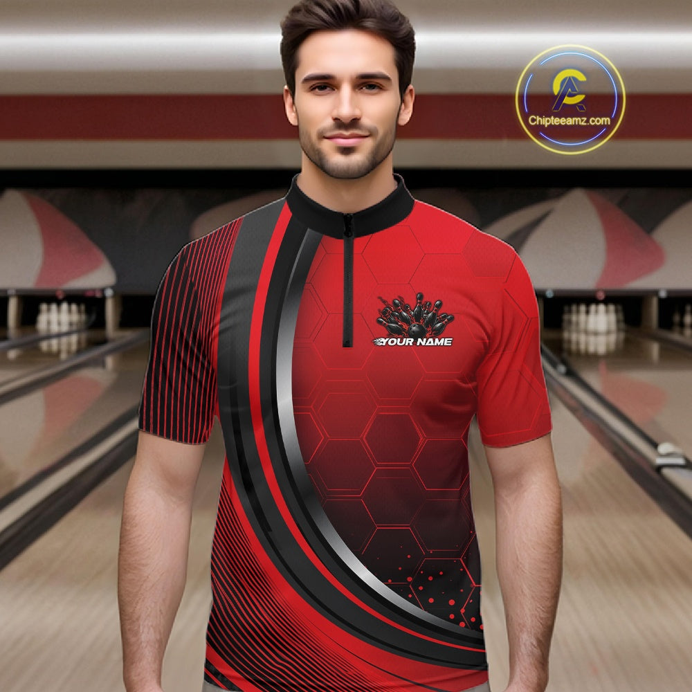 Male model in a bowling lane wearing a black and red quarter zip shirt with honeycomb texture and a flaming bowling strike graphic.