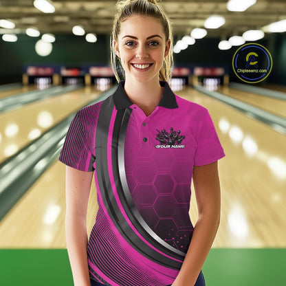 Female model in a bowling lane wearing a black and pink polo shirt with honeycomb graphics and a dynamic flame bowling strike design.